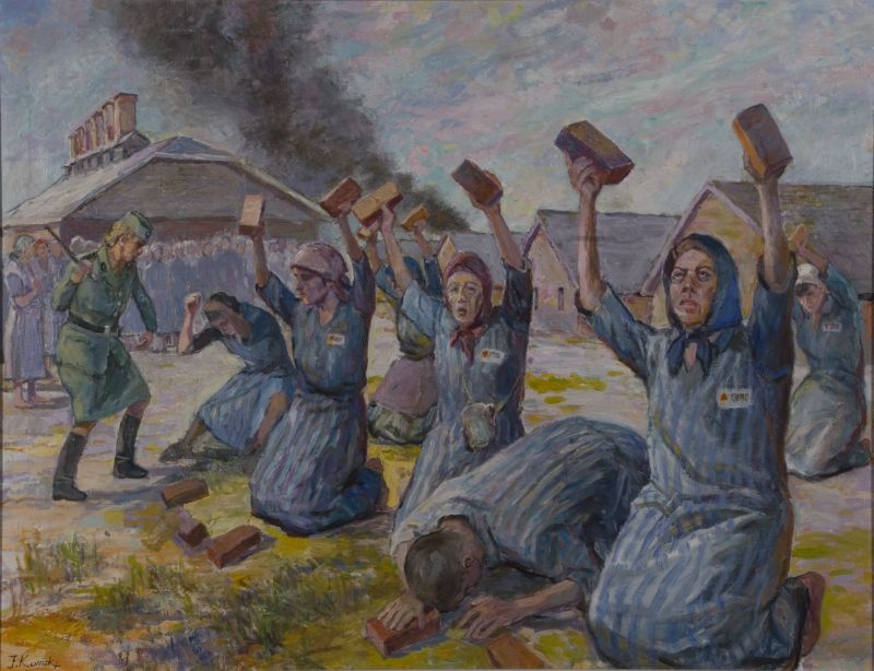 Women prisoners sitting on their knees, holding two bricks with their hands above their heads. SS man is standing next to them and shouting. Barracks and smoke in the background.