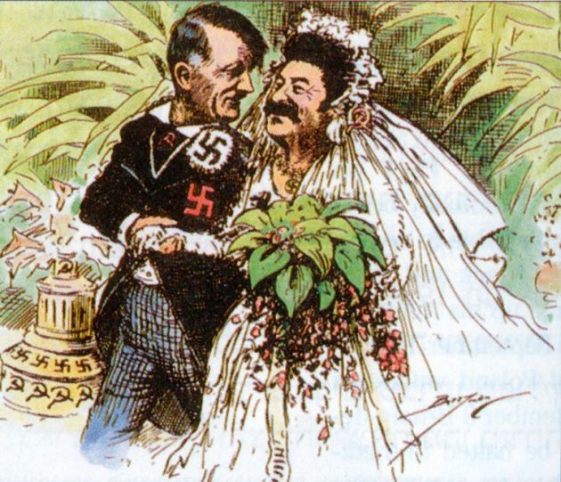Married couple - Adolf Hitler as the groom with a swastika on his jacket lapel, Stalin as the bride. He has a sickle and hammer pinned into his veil. Both figures smiling.