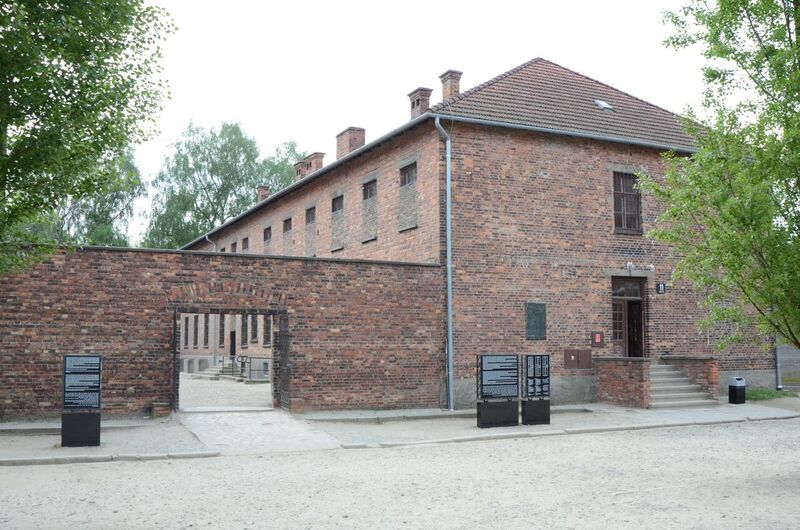 A two-storey brick-walled building with a sloping roof - block 11. Between the two blocks 10 and 11 there is a wall with an open door to the courtyard where the prisoners were being murdered.