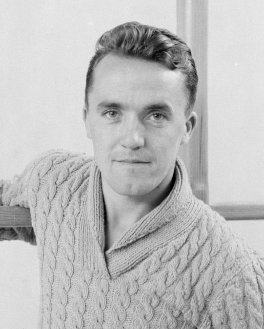 Portrait photograph of Bronisław Czech. Face focused, cheerful, gaze directed towards the lens. Dressed in a jumper with a stand-up collar.