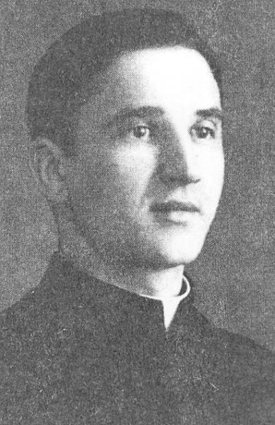 Father Wojciech Nierychlewski, wearing a habit and clerical collar in the photo.