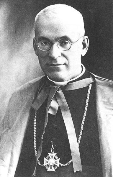 Father Roman Sitko, in the photo wearing a cassock and a cape, with a cross on his chest.